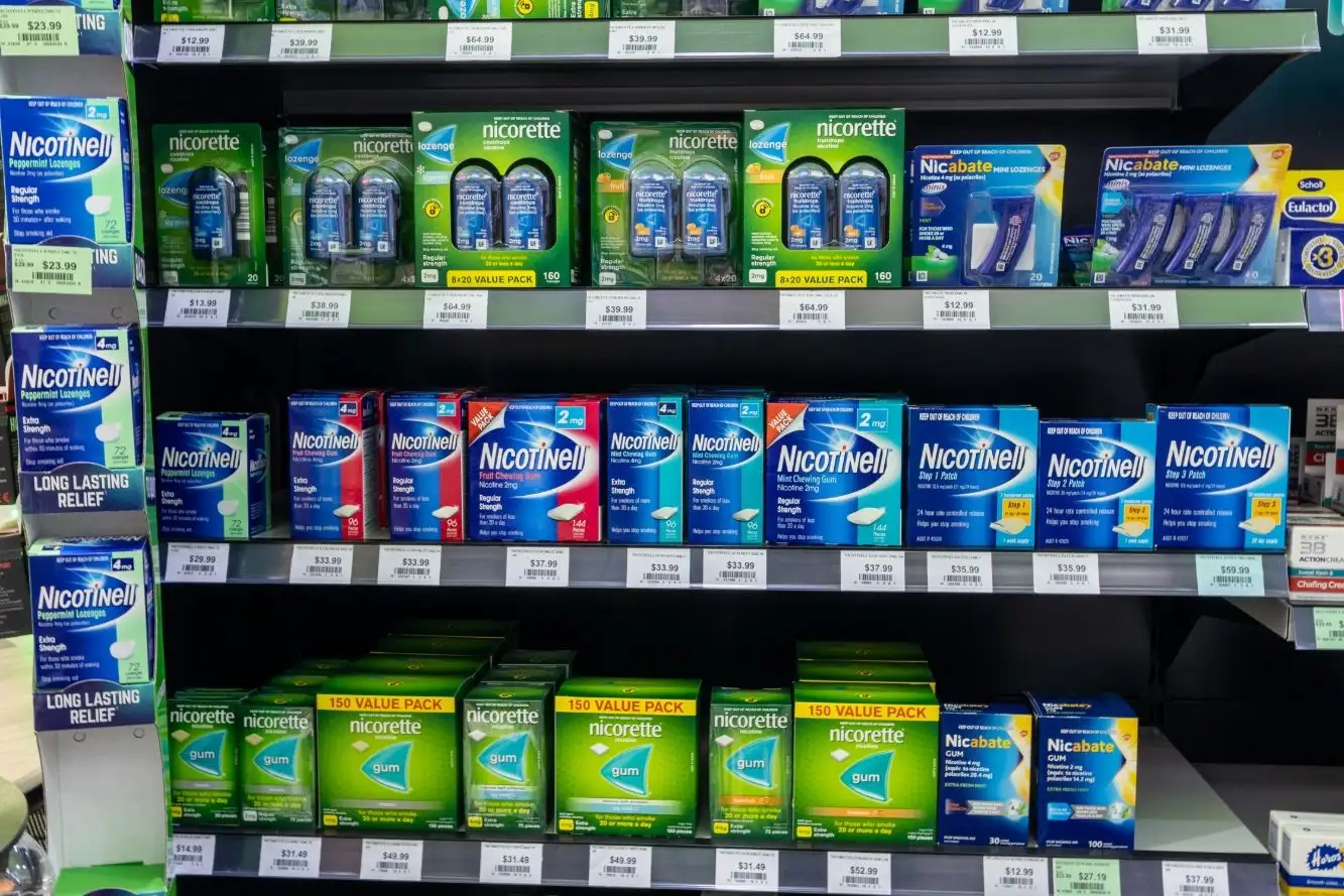 Nicotine replacement therapy on the shelf at Priceline Pharmacy Pacific Fair: lozenges, gum and patches