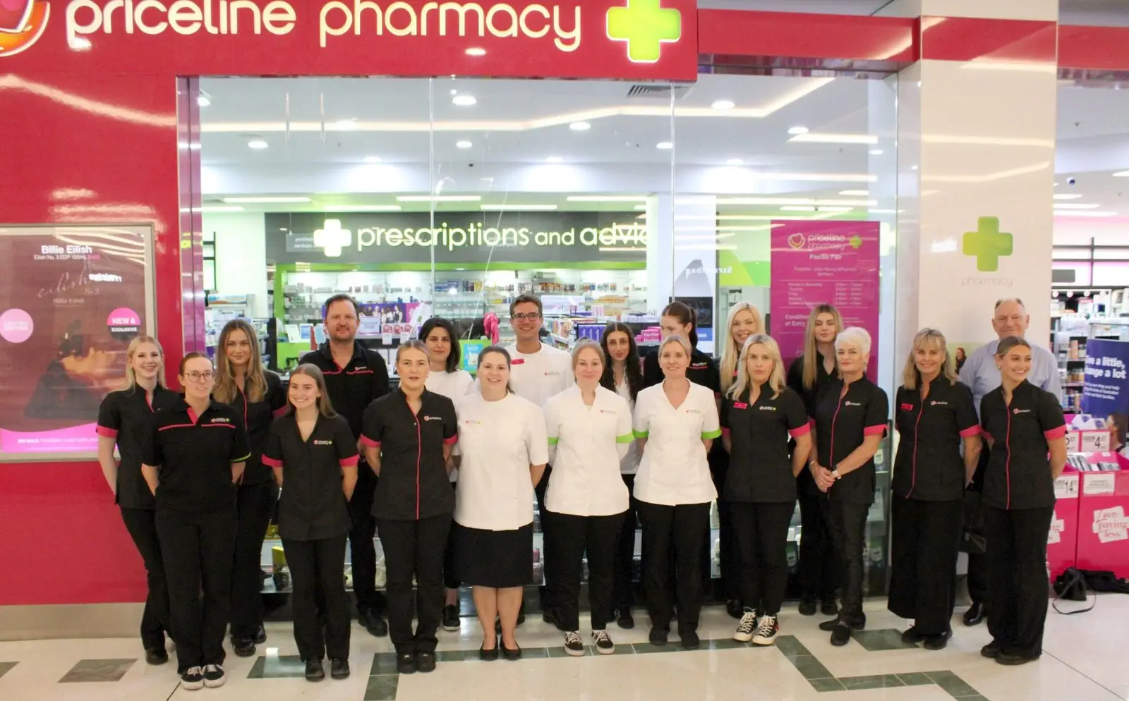 The Priceline Pharmacy Pacific Fair team in uniform, standing outside the store