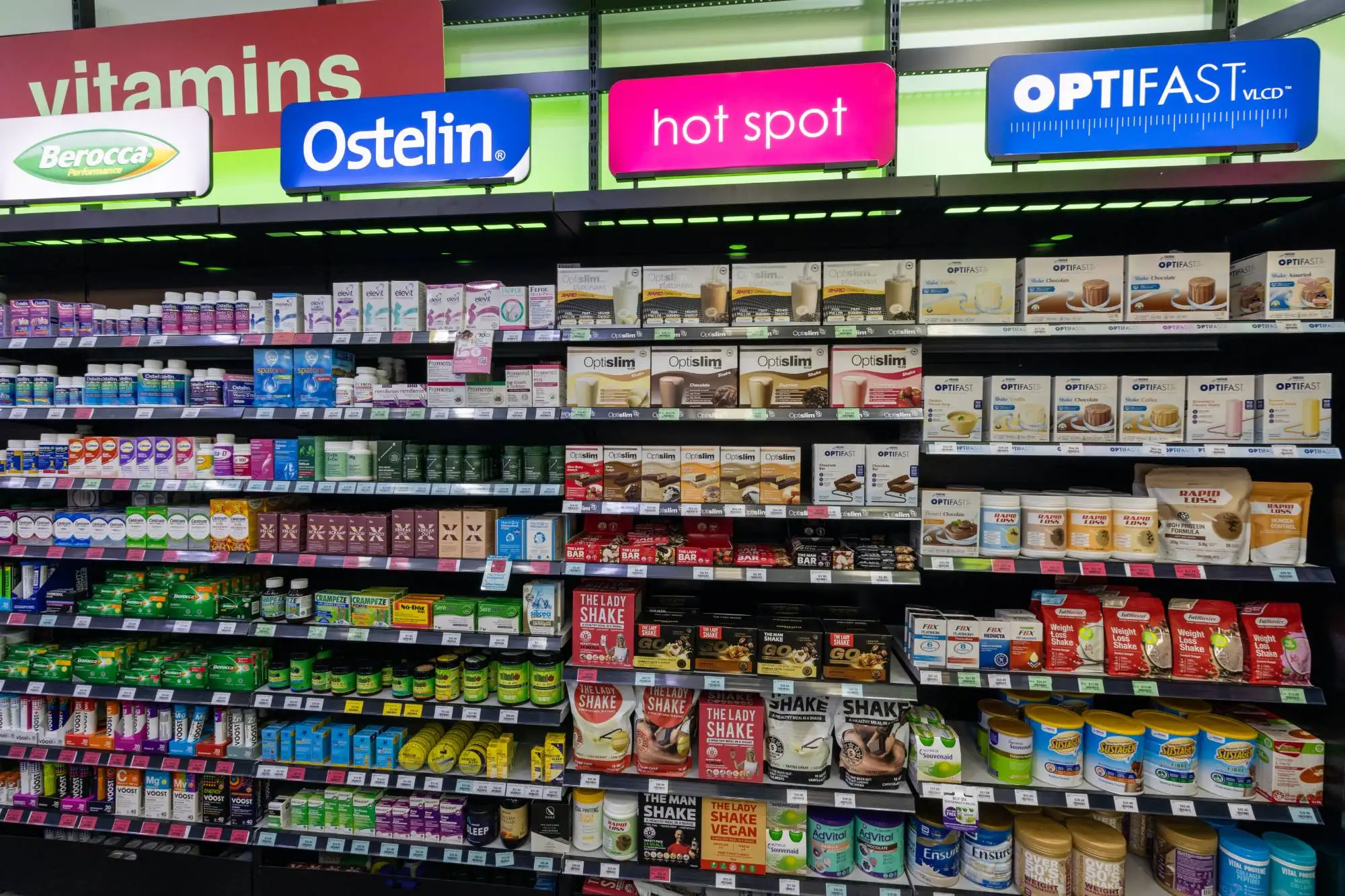 Meal replacement shakes, vitamins and weight management products on the shelves at Priceline Pharmacy Pacific Fair